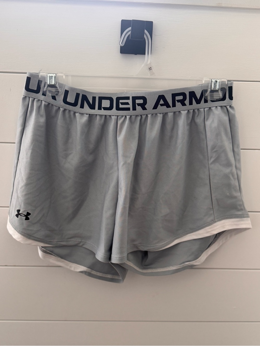 Under Armour Women's Light Gray Athletic Shorts with Black Logo